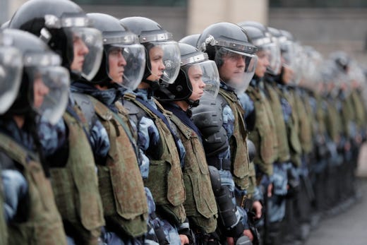 Russian riot police stand in readiness during a liberal opposition rally against unfair Moscow State Duma elections in the center of Moscow, Russia on Aug. 10, 2019. The liberal opposition called their supporters to continue their protest actions against rejecting their candidates for Moscow City Duma elections, which are scheduled for 08 September. Reports say that about seven thousand protesters participate at the rally despite extremely wet and stormy weather. 