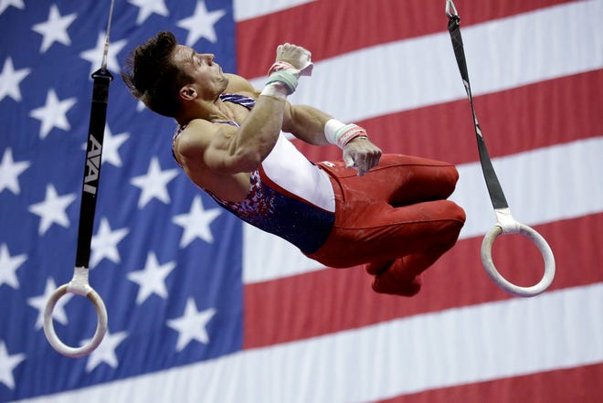 Samuel Mikulak competes on the rings.