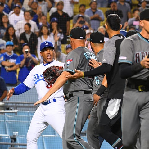 Los Angeles Dodgers manager Dave Roberts yells at...
