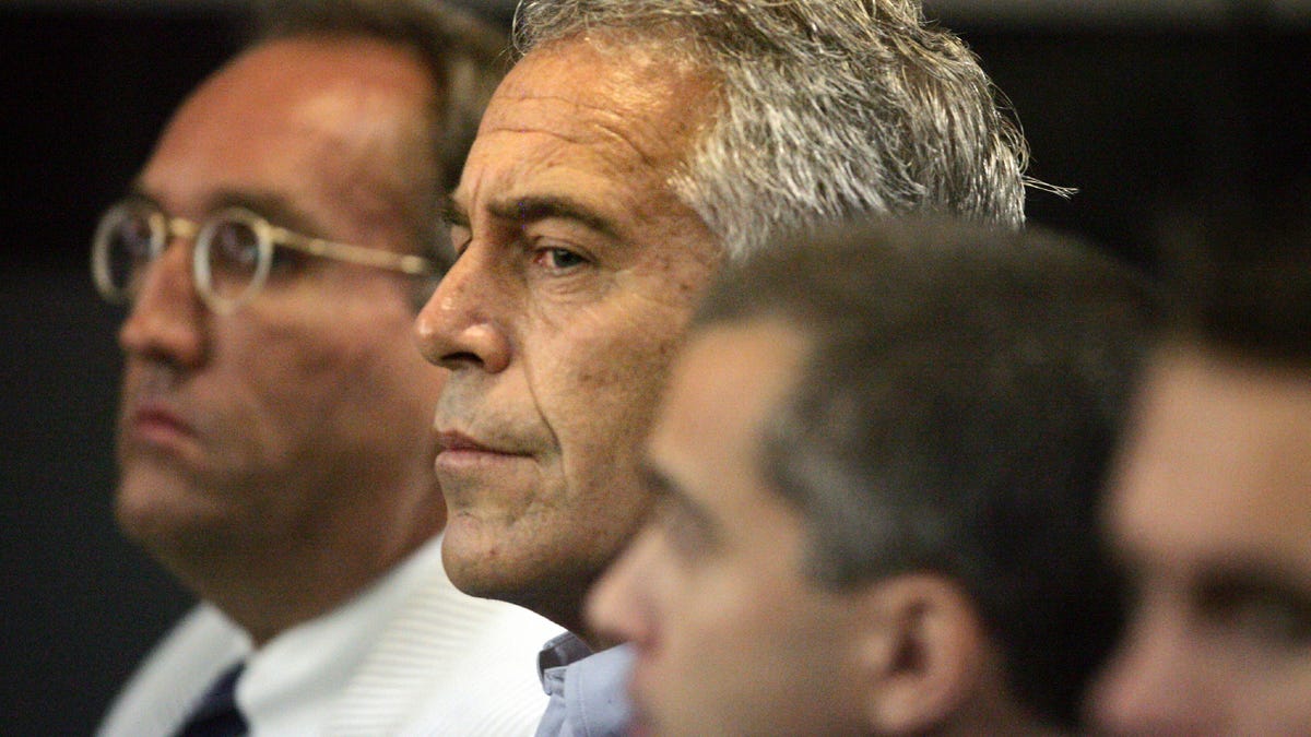 FILE - In this July 30, 2008, file photo, Jeffrey Epstein, center, appears in court in West Palm Beach, Fla.  Newly released court documents show that Epstein repeatedly declined to answer questions about sex abuse as part of a lawsuit. A partial transcript of the September 2016 deposition was included in hundreds of pages of documents placed in a public file Friday, Aug. 9, 2019 by a federal appeals court in New York. Epstein has pleaded not guilty to   sex trafficking charges after his July 6 arrest.  (Uma Sanghvi/Palm Beach Post via AP, File) ORG XMIT: FLPAP127
