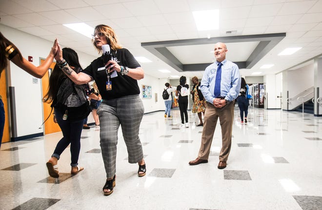 Melissa Robery, the principal of East Lee County High School, has been named Lee County schools' Principal of the Year. Here, she greets students on the first day of school on Monday, August, 12, 2019, alongside Superintendent Greg Adkins.