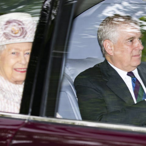 Queen Elizabeth II and Prince Andrew are driven...