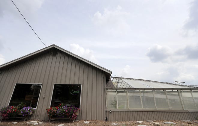Twigs & Vines Floral in Appleton is open, but its attached greenhouse was destroyed by a storm that came through Appleton on July 20.