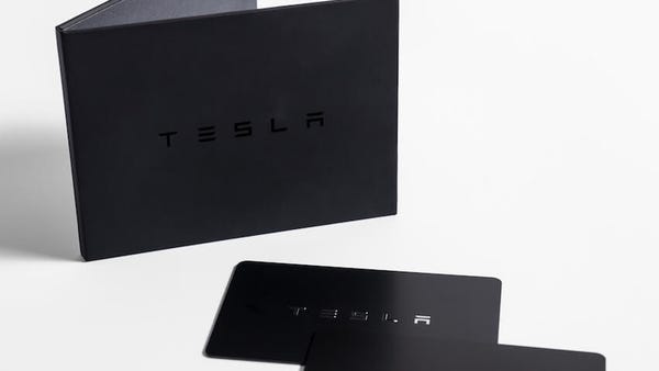 Tesla's Model 3 comes with two key cards which...