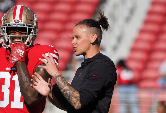 San Francisco 49ers offensive assistant Katie Sowers credits Goshen's rejection for getting her back to football.