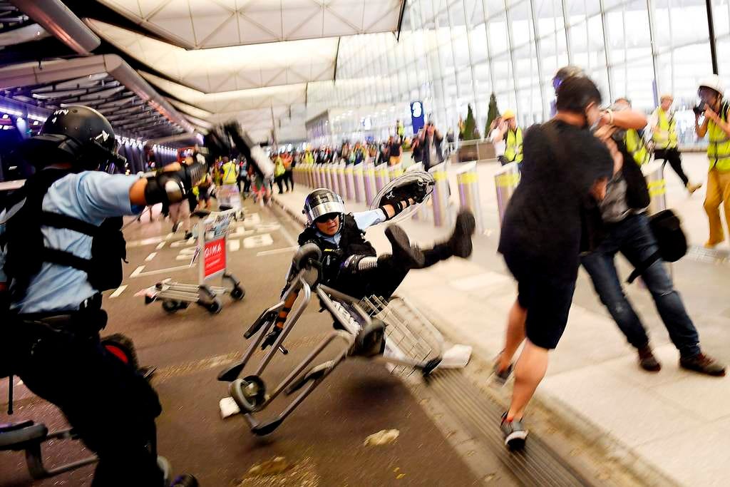 Ten dramatic images from the Hong Kong airport protests and clashes with police