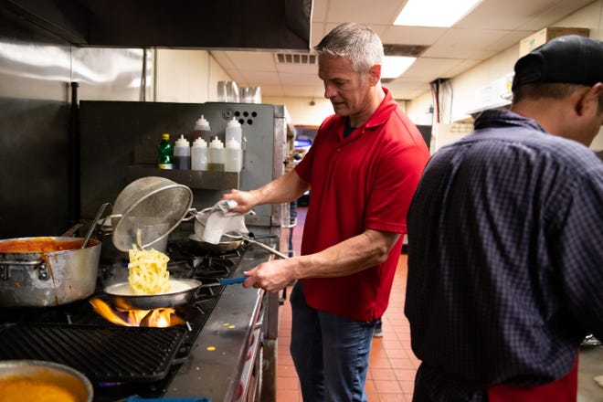 NY Joe's Restaurant owner Nathan Woodard cooks fettuccine Alfredo during the lunch rush on Tuesday, 13, 2019. NY Joe's recently relocated from the Southside to Flour Bluff.