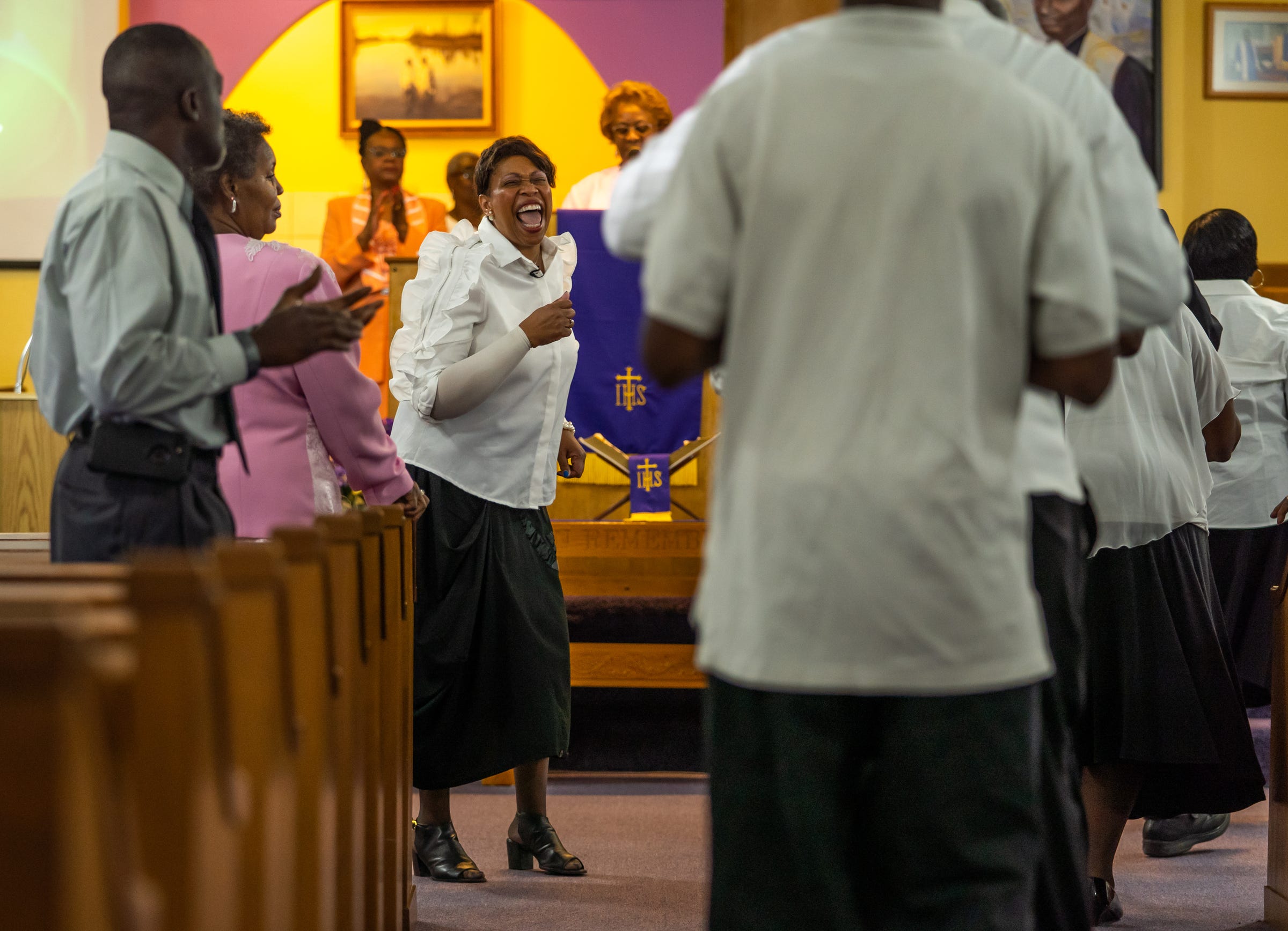 Carolynn Lofton of Belleville leads the choir during services at Christian Tabernacle Baptist Church in Ypsilanti on Sunday, July 14, 2019.