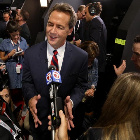 Montana Governor Steve Bullock talks with the medi