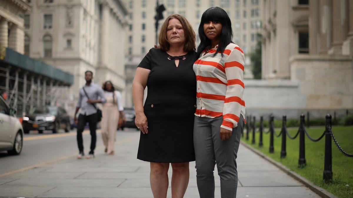 Joanne Schoonmaker, left, and Auset Love pose for a photo outside the New York City Department of Education after a news conference Love and Schoonmaker both filed lawsuits alleging they were sexually abused as children in New York state after the passage of the New York Child Victims Act.
