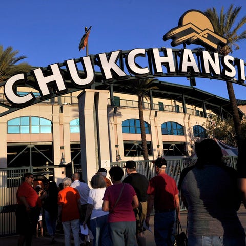 Fans arrive at Chukchansi Park, home of the...