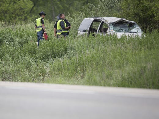 Authorities at the scene of a van crash along the Muncie Bypass on May 28, 2017. A 6-year-old girl, Taelyn Woodson, was killed when she was partially ejected from the vehicle, leading to criminal charges against her mother and that woman's boyfriend.