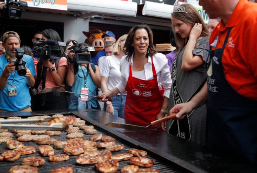 Democratic presidential candidate Sen. Kamala Harris, D-CA, flips pork chops at the Iowa State Fair on August 10, 2019. 