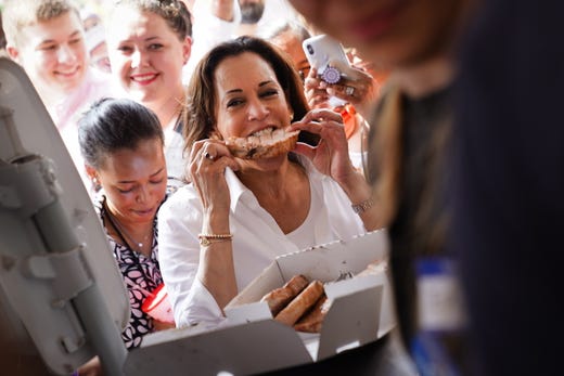US Senator and Democratic presidential candidate Kamala Harris eats a pork chop at the Iowa State Fair on August 10, 2019. 