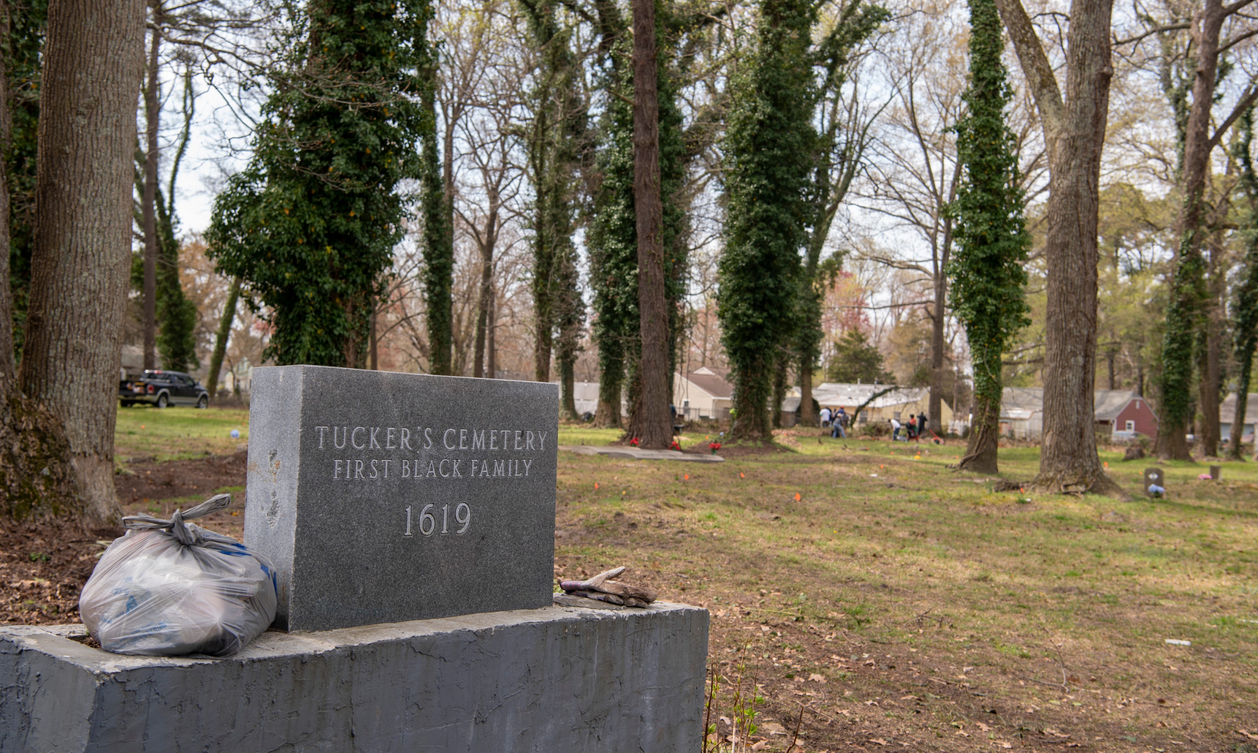 Volunteers help clean up debris during the family's volunteer cleanup efforts at the Tucker Family Cemetery in Hampton, Va. on Saturday, March 30, 2019.
