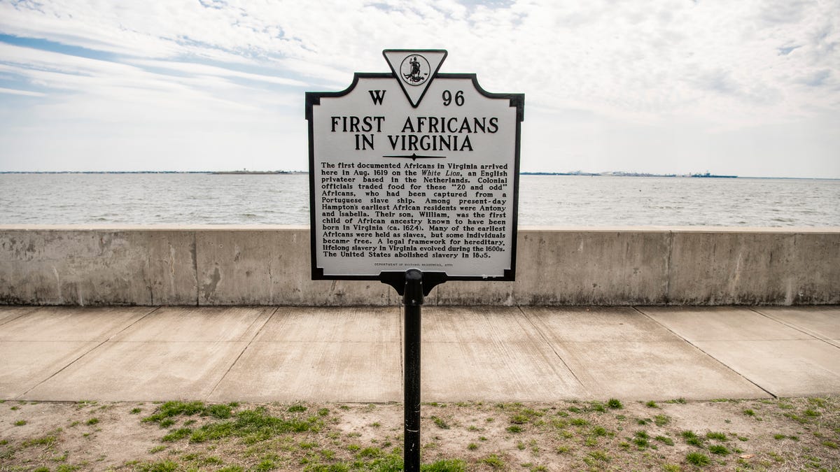 A historical marker sits at Fort Monroe, then known as Point Comfort, to mark the arrival ion the first "20 and odd" Africans to America is seen on Saturday, March 30, 2019 in Hampton, VA.