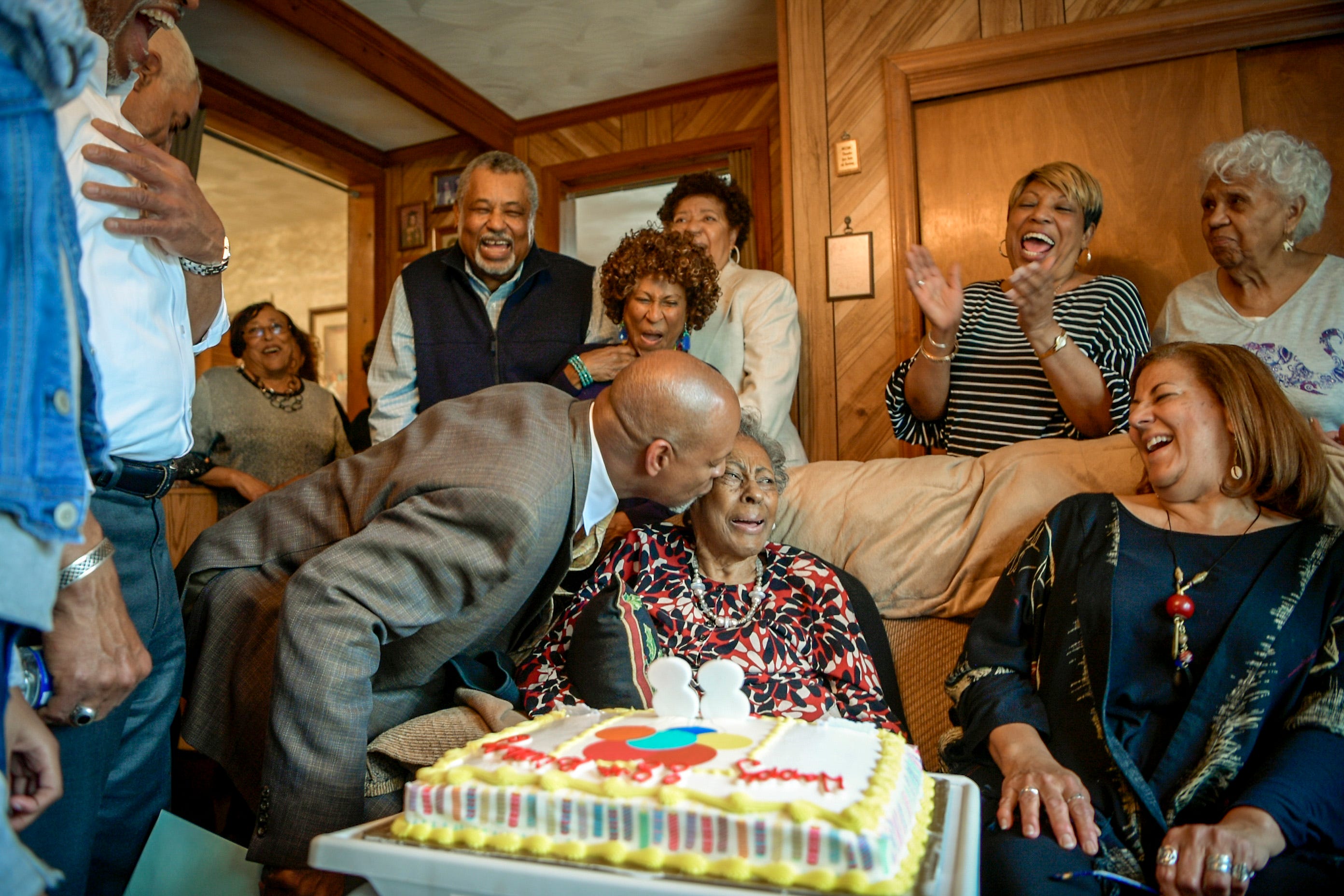 Vincent Tucker plants a kiss on Carol Tucker Jones during her 88th birthday celebration in Hampton, Va. on Sunday, March 31, 2019.