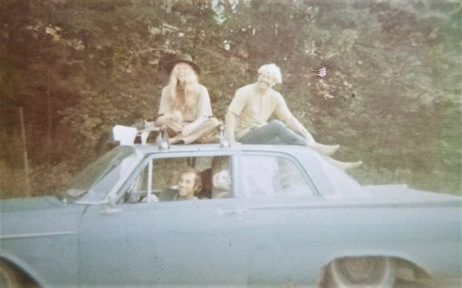 Retired Rockledge High physics teacher Skip Arrich is seen on the top of a car headed to Woodstock in 1969. He and the two friends with him on the trip sold 1,000 T-shirts they silk-screened with a logo upon hearing of the festival.
