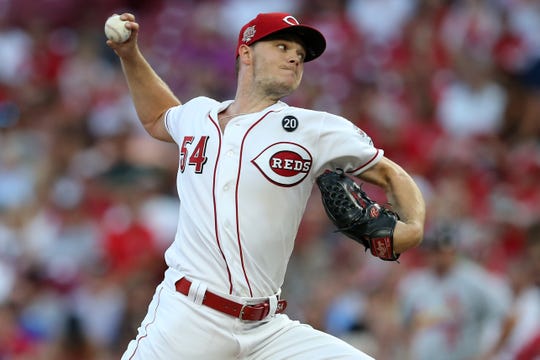 Cincinnati Reds starting pitcher Sonny Gray (54) delivers in the third inning of an MLB baseball game against the St. Louis Cardinals, Thursday, Aug. 15, 2019, at Great American Ball Park in Cincinnati. 