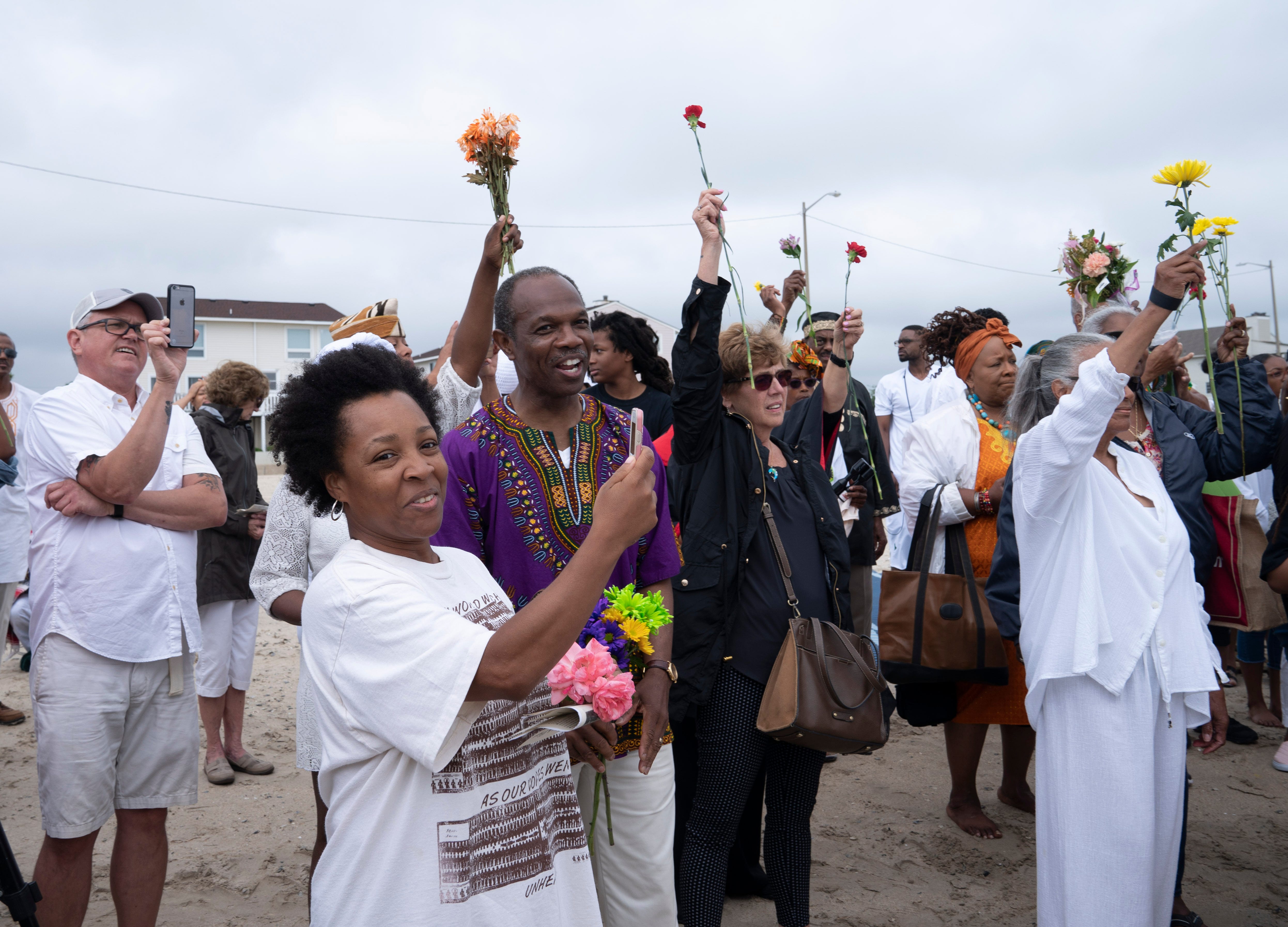 Every year Hampton residents, including Mayor Donnie Tuck in purple, gather at the "Day of Remembrance" to honor ancestors who were taken to America.