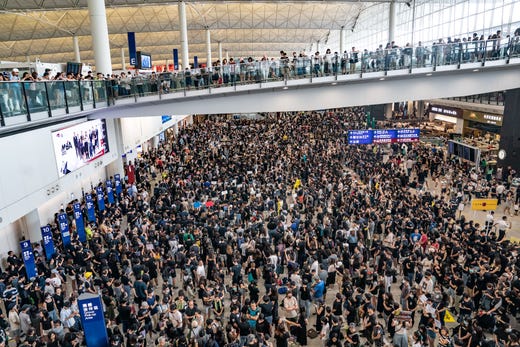 Protesters occupy the arrival hall of the Hong Kong International Airport during a demonstration on Aug. 11, 2019 in Hong Kong, China. Pro-democracy protesters have continued rallies on the streets of Hong Kong against a controversial extradition bill since June 9 as the city plunged into crisis after waves of demonstrations and several violent clashes.