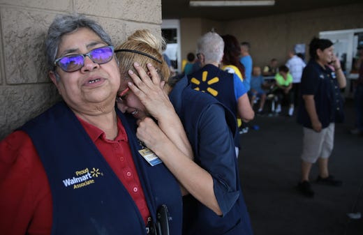 WalMart employees react after an active shooter opened fire at the store at Cielo Vista Mall in El Paso, Texas on Saturday, on Aug. 3, 2019.