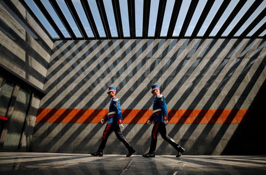 Soldiers walk after laying wreaths during a commemoration of the Roma Holocaust Memorial Day, in Bucharest, Romania, Aug. 2, 2019. During the event Romania's minister of culture Daniel Breaz described the WWII plight of the Romanian Roma, when, according to the Elie Wiesel Institute for the Study of the Holocaust in Romania 50,000 Roma were deported to Trans-Dniester in the Soviet Union and 11,000 died as "delicate moments, when unpleasant things happened and certain minorities suffered."