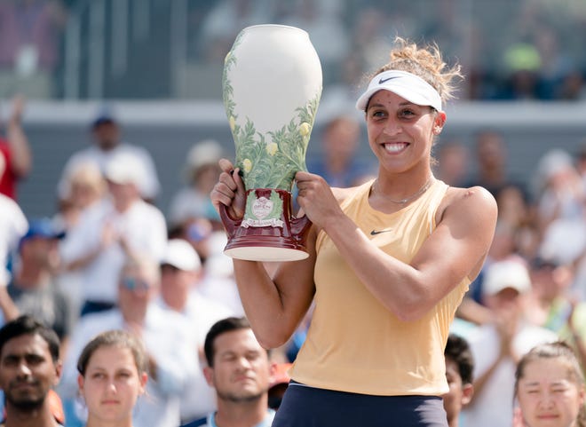 Madison Keys lifts the Rookwood Trophy after defeating Svetlana Kuznetsova 7-5, 7-6 in the Western & Southern Open tennis tournament finals match between on Sunday, Aug. 18, 2019, in Mason.