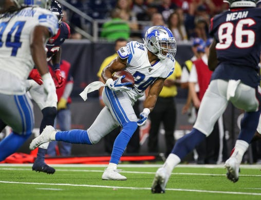 Detroit Lions defensive back Andrew Adams runs with the ball after making an interception during the second quarter against the Houston Texans at NRG Stadium on August 17, 2019 in Houston.
