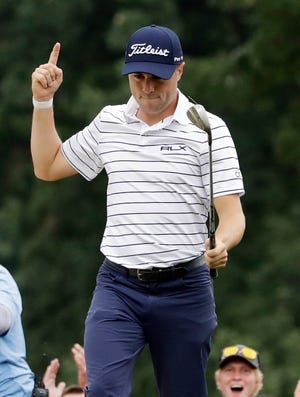 Justin Thomas celebrates after making a birdie on the 14th hole Saturday during the third round of the BMW Championship golf tournament at Medinah Country Club.