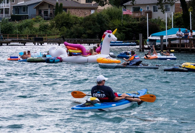 Participants in the Port Huron Float Down make their way down the St. Clair River during the annual, non-sanctioned event on Sunday, Aug. 18, 2019. 