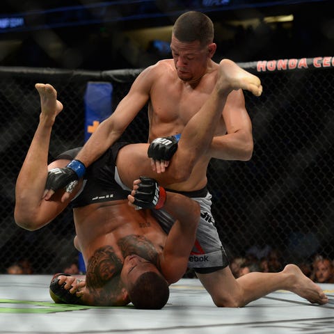 Nate Diaz pins Anthony Pettis to the mat during...