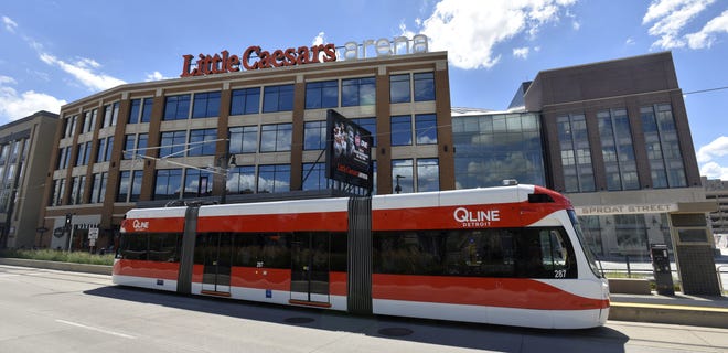 A QLine Detroit streetcar departs the Sproat Street station