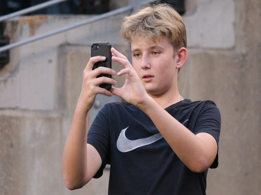 Barron Trump taller than mom in heels sporting new haircut