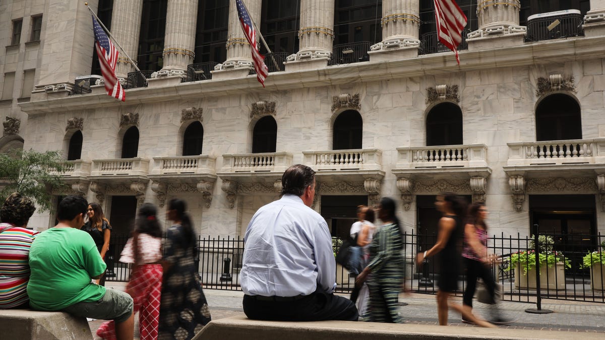 People walk by the New York Stock Exchange (NYSE) on August 14, 2019 in New York City. 56