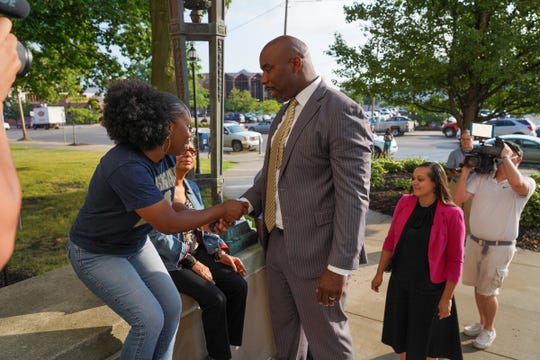 A woman talks with former Michigan State basketball star Mateen Cleaves while showing support for him before he enters Genesee County Circuit Court on Tuesday, August 20, 2019 for closing arguments of his trial on sexual assault charges.Cleaves is charged with numerous counts related to theu00a0alleged incident that prosecutors say took place after he met the woman at a charity golf outing in September.