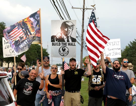 Members of the Proud Boys hold up the White Power sign when yelling and chanting towards protesters against the caging of kids at the Southern border by CBP.
Competing rallies were being held in front of the Holocaust Memorial Center in Farmington Hills, Michigan on Tuesday, August, 20, 2019.