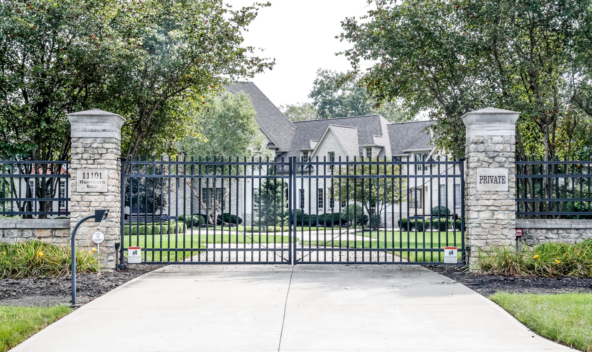 Rob New's former 16,000-square-foot mansion in Fishers features a swimming pool, hot tub, wine cellar and six-car garage that doubles as an indoor basketball court.