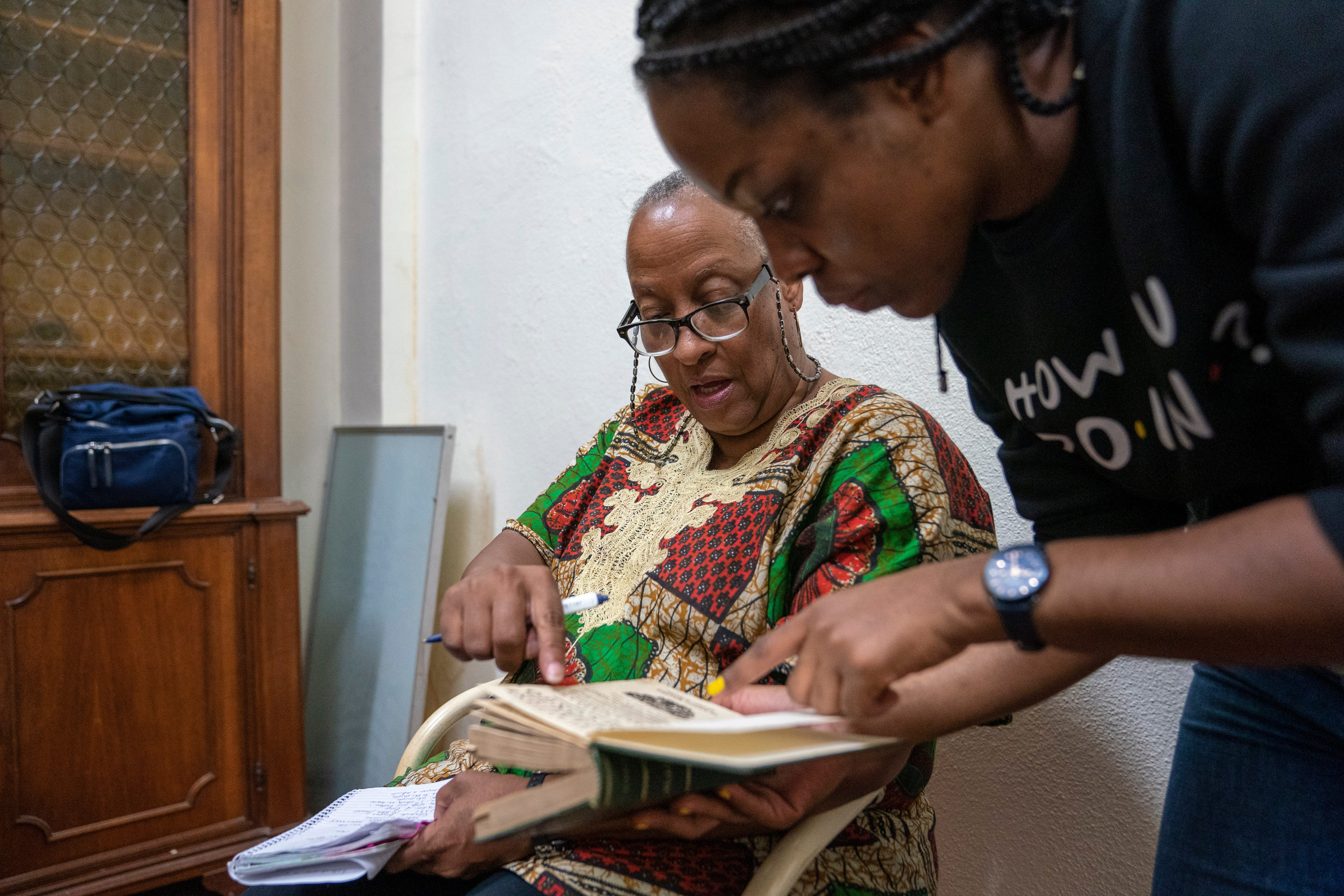 Wanda Tucker listens as Yolanda Manuel translates at the Church of St Mary of Fatima.