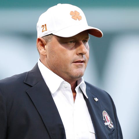 Boston Red Sox former player Roger Clemens walks o
