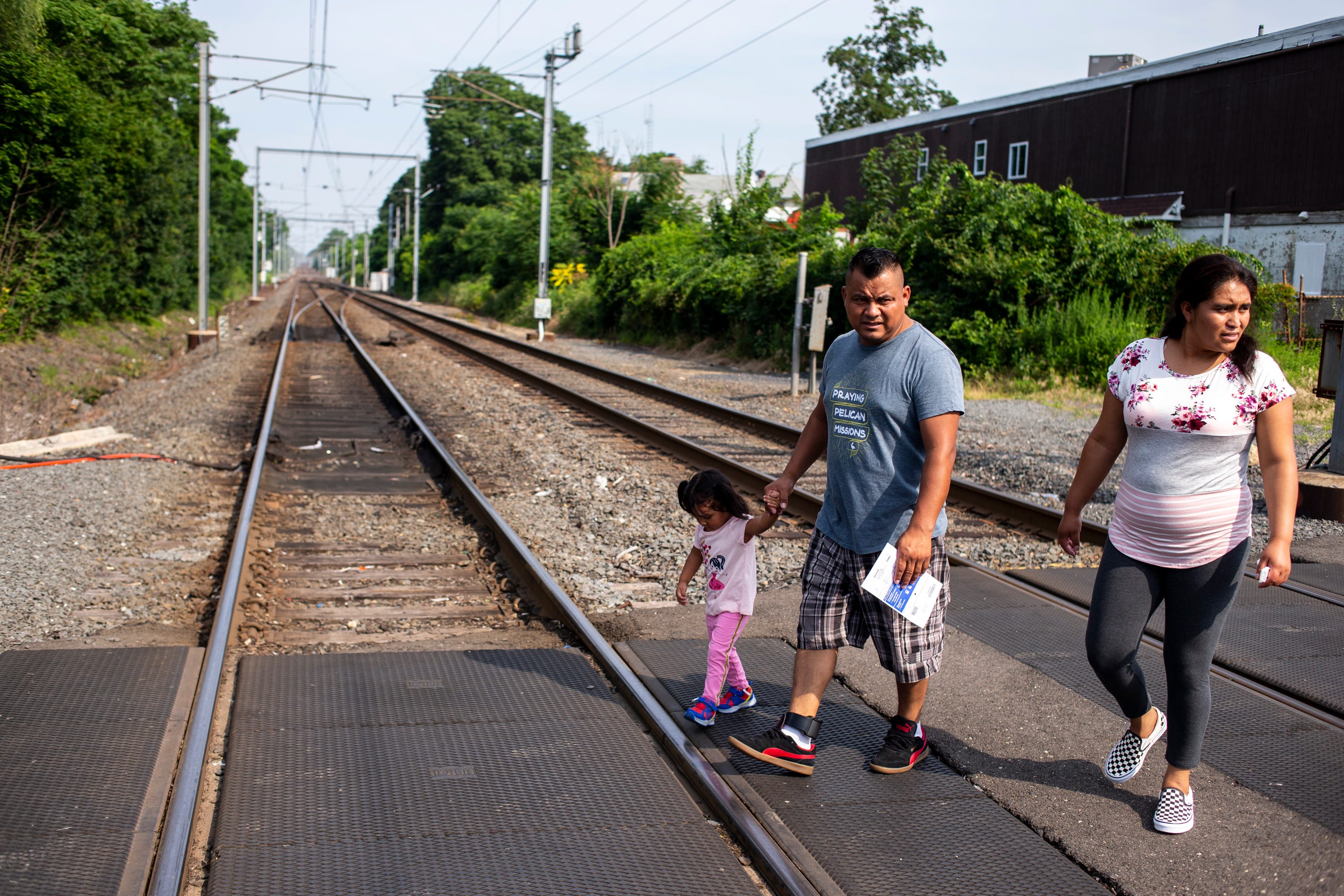 LONG BRANCH, N.J. – Jaime Escalante Galvez, 35, Leydi Gonzalez, 29, and their daughter, Adriana Escalante Gonzalez, 2, walk to a park on June 29, 2019.