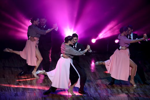 Couples dance during a show prior to the finals of the Salon category at the annual Tango Dance World Championship in Buenos Aires, Argentina, Aug. 20, 2019.