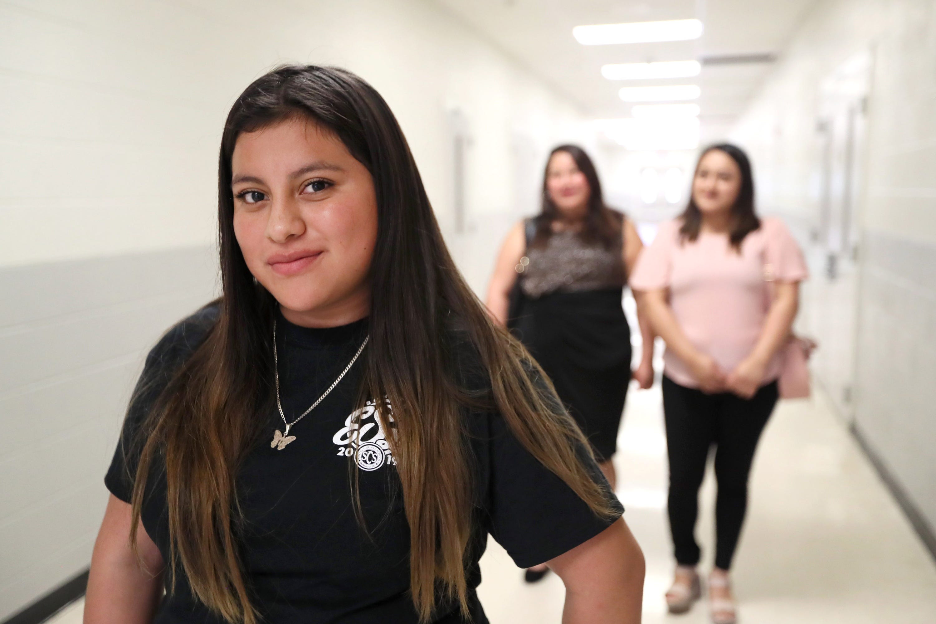 MEMPHIS, Tenn. – Daniela Rivera, 14, poses for a portrait with her mother Marisela Ramos, 34, and older sister Mary Rivera, 19. The family, who immigrated from Guatemala, was on hand for Daniela’s graduation from a summer English as a Second Language program for newly arrived immigrant students.