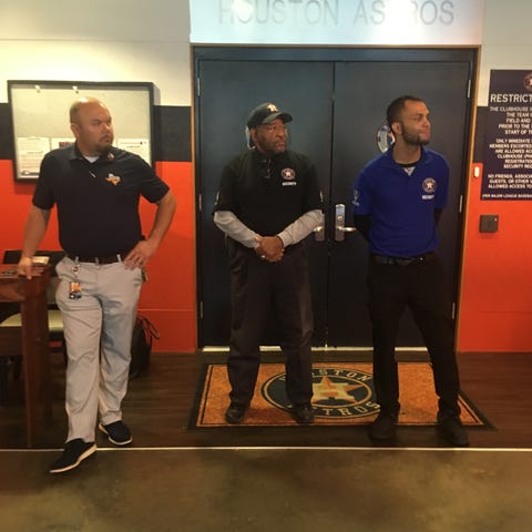 Houston Astros security officials stand in front o