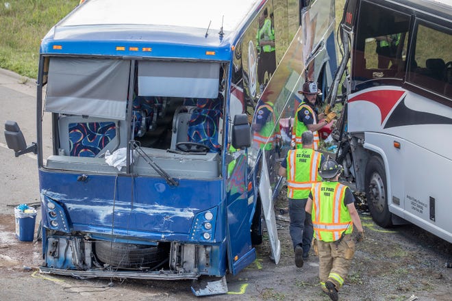 St. Paul paramedics, police crew and firefighters worked the scene of a two-bus accident at the corner of Larpenteur Avenue and Highway 280, Thursday, August 22, 2019 on the Minnneapolis/St. Paul border.