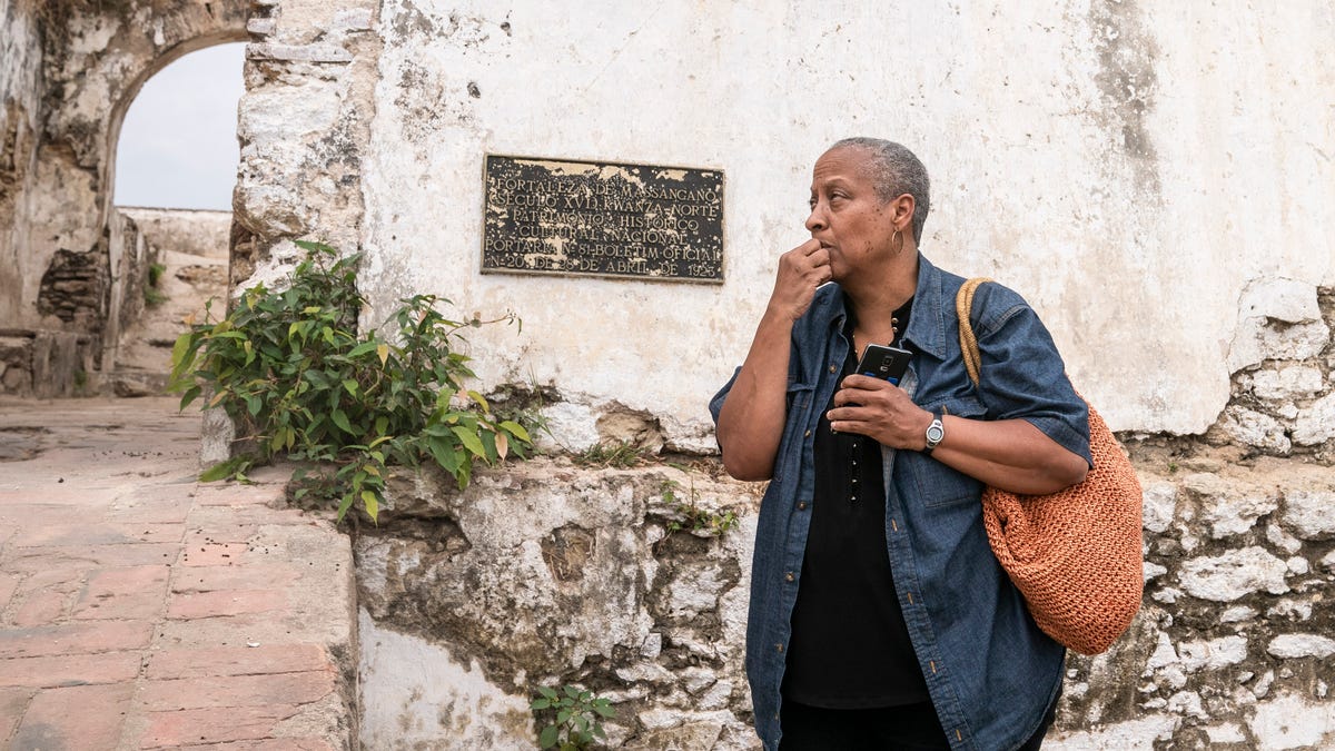 1619 Project: Wanda Tucker sits outside of the Fortaleza de Massangano on Saturday, Aug. 3, 2019 in Angola.