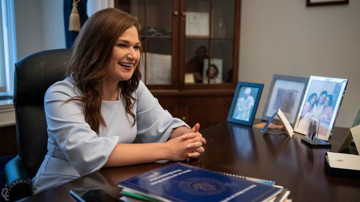 Washington, DC  --  Rep. Abby Finkenauer, D-Iowa, sits surrounded by photos of her friends and family and other mementos including Michelle Obama's book in her office on Capitol Hill on June 27, 2019. The moderate Democrat is the only freshman to chair a subcommittee, and is the second-youngest person to serve in Congress. --    Photo by Hannah Gaber, USA TODAY