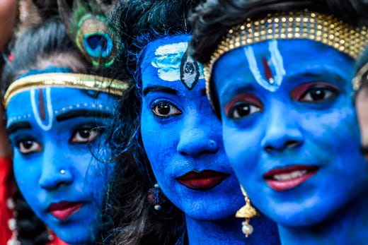 Students dressed up as Hindu gods Lord Krishna and Lord Shiva participate in a cultural event in their school in Mumbai on Aug. 21, 2019. 