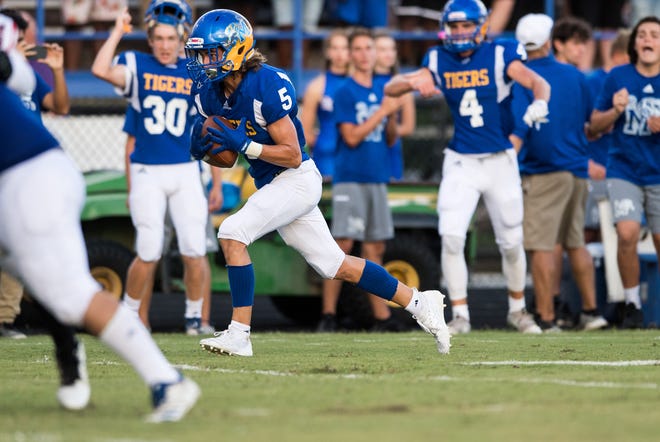 Martin County's Augie Lovelace intercepts a pass against Port St. Lucie on Thursday, Aug. 22, 2019, at Martin County High School in Stuart.