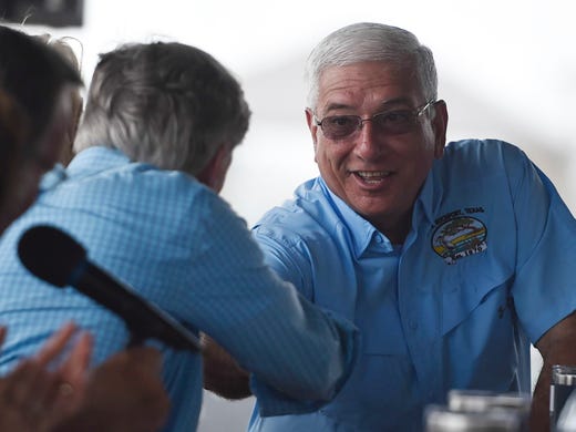 Texas Gov. Greg Abbott signs House Bill 6 and Senate Bill 6 at the Fulton fishing pier groundbreaking, Saturday, Aug. 24, 2019, in Fulton. Fulton Mayor Jimmy Kendrick, Sen. Lois Kolkhorst, Rep. Todd Hunter and Geanie Morrison were also in attendance. 